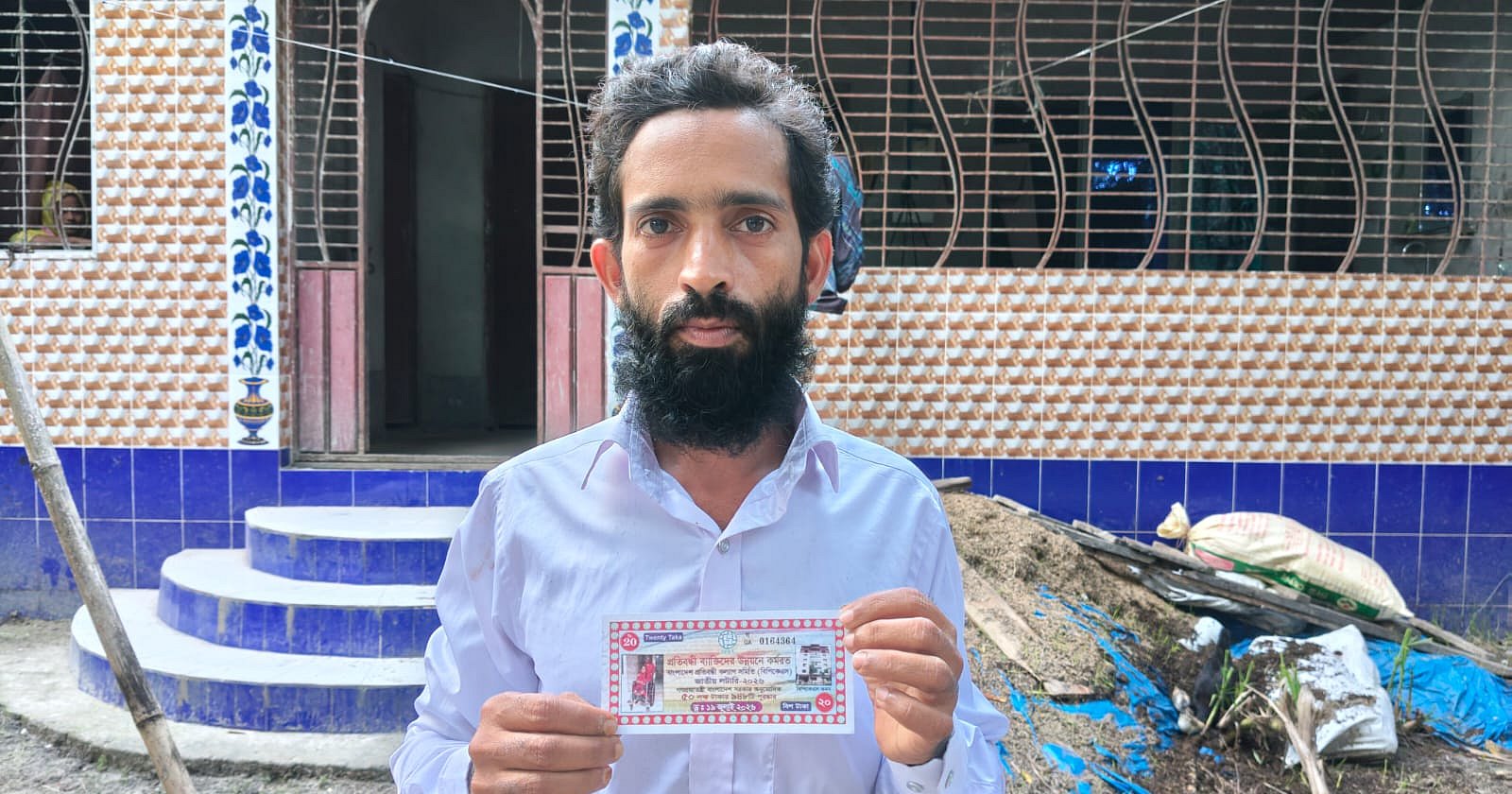 ২০ টাকার টিকিটে ৩০ লাখ টাকার স্বপ্ন, যাচাইয়ে অপেক্ষা কৃষক হানিফের